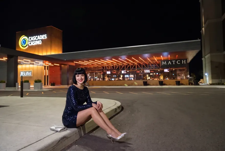 Woman on the curb by the MATCH patio at night